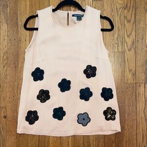 Women's Sleeveless Top with Floral Accents